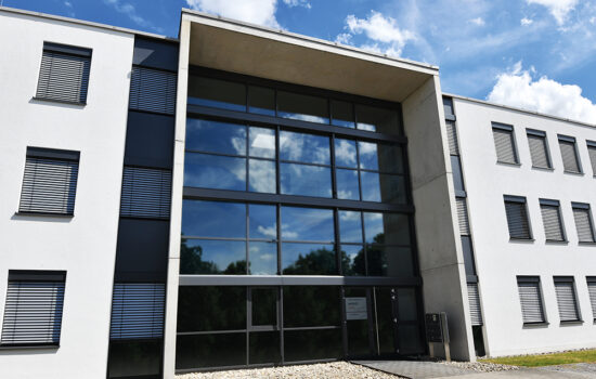 Office building of the speedikon FM Group with a modern glass façade.